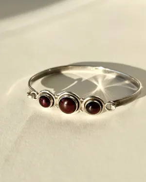 hinged silver bracelet with garnets